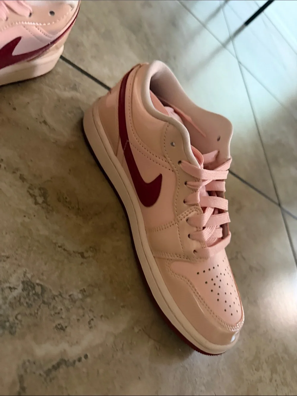 Nike Women’s Low-Top Sneakers in Light Pink with Burgundy Swoosh